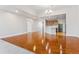 Open concept living area featuring hardwood floors and an updated kitchen with a breakfast bar at 6000 W Floyd Ave # 116, Denver, CO 80227