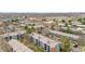 An aerial view shows tree-lined streets and well-maintained condo complexes in the community at 3656 S Depew St # 102, Denver, CO 80235