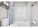 A full bathroom featuring a shower and bathtub combination at 3656 S Depew St # 102, Denver, CO 80235