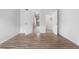 This empty bedroom features laminate wood flooring and two closets, ideal for storage at 3656 S Depew St # 102, Denver, CO 80235