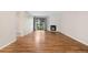 Spacious living area featuring wood floors, a fireplace, and sliding glass doors to the outside at 3656 S Depew St # 102, Denver, CO 80235