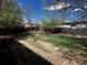 Large back yard featuring mature trees, grassy space and full fence for outdoor enjoyment and relaxation at 1021 Downing Way, Denver, CO 80229