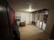 Unfinished basement featuring tile floors with exposed framing for future remodeling and renovation at 1021 Downing Way, Denver, CO 80229