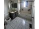Bathroom featuring a tiled bathtub, shower, toilet, and vanity with mirror and lighting at 1021 Downing Way, Denver, CO 80229