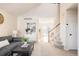 Bright living room with a view into the kitchen and stairs at 5604 S Yakima Way, Aurora, CO 80015