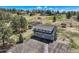 Aerial view of a grey detached garage with apartment above on beautiful acreage at 12454 Antelope Trl, Parker, CO 80138