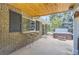 Covered patio with an outdoor bar and a relaxing hot tub at 12454 Antelope Trl, Parker, CO 80138