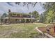 Expansive backyard with lush lawn, patio area, mature trees, and hot tub, perfect for outdoor enjoyment and relaxation at 12454 Antelope Trl, Parker, CO 80138