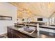 Entertaining area with long counters and a sink overlooking the game room, perfect for hosting gatherings and events at 12454 Antelope Trl, Parker, CO 80138