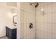 A modern shower boasts subway tile, contemporary fixtures, and convenient shelving at 12454 Antelope Trl, Parker, CO 80138