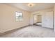 Spacious bedroom with neutral tones, plush carpeting, and mirrored closet doors at 12454 Antelope Trl, Parker, CO 80138