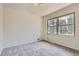 Bright and airy bedroom with double window, neutral walls, and plush carpet at 12454 Antelope Trl, Parker, CO 80138