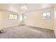 A spacious bedroom with neutral walls and large windows for plenty of natural light at 12454 Antelope Trl, Parker, CO 80138
