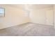Bright bedroom with neutral walls, plush gray carpeting, and ample natural light from two windows at 12454 Antelope Trl, Parker, CO 80138
