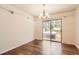 Open dining area with hardwood floors and access to a backyard patio and spa at 12454 Antelope Trl, Parker, CO 80138