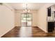 Dining room with hardwood floors and sliding glass door leading to an outdoor hot tub at 12454 Antelope Trl, Parker, CO 80138