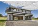 Open three-car garage featuring wood-paneled walls, access to the backyard, and potential for a workshop or hobby space at 12454 Antelope Trl, Parker, CO 80138