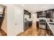 Modern kitchen featuring stainless steel appliances, granite countertops, and dark wood cabinetry, providing style and functionality at 12454 Antelope Trl, Parker, CO 80138