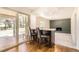 Bright breakfast bar with seating, stone countertops, and natural light streaming through sliding glass doors at 12454 Antelope Trl, Parker, CO 80138