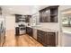 Well-appointed kitchen with stainless steel appliances, granite countertops, and dark cabinetry, combining elegance and practicality at 12454 Antelope Trl, Parker, CO 80138