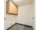 Functional laundry room with upper cabinets and tile flooring ready for appliances at 12454 Antelope Trl, Parker, CO 80138