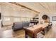 Large recreational room with a wood plank ceiling, a seating area, pool table, shuffle board and wet bar at 12454 Antelope Trl, Parker, CO 80138