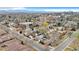 Neighborhood aerial view shows well-maintained properties, mature trees and quiet streets at 2455 E Yale Ave, Denver, CO 80210