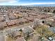 Aerial view showcases a neighborhood with tree-lined streets and well-kept homes at 2455 E Yale Ave, Denver, CO 80210