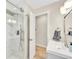 Contemporary bathroom featuring sleek fixtures, bright lighting, and glass-enclosed shower at 2455 E Yale Ave, Denver, CO 80210