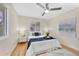 Bedroom featuring a ceiling fan, natural light, and wood floors at 2455 E Yale Ave, Denver, CO 80210