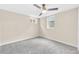 Finished basement bedroom featuring soft carpeting, neutral walls, and a ceiling fan at 2455 E Yale Ave, Denver, CO 80210