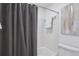 This clean and simple bathroom has white tile and a shower at 4970 S Chester St, Greenwood Village, CO 80111