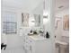 A bright bathroom has a modern vanity and large mirror at 4970 S Chester St, Greenwood Village, CO 80111