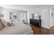 A bright bedroom features hardwood floors, neutral walls, and contemporary decor at 4970 S Chester St, Greenwood Village, CO 80111