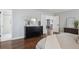 The bedroom features hardwood floors and a view into the bathroom and through to another room at 4970 S Chester St, Greenwood Village, CO 80111