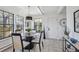 Bright dining area featuring tile floors, contemporary light fixture and many windows at 4970 S Chester St, Greenwood Village, CO 80111