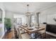 Bright dining room featuring a modern chandelier and wood floors at 4970 S Chester St, Greenwood Village, CO 80111