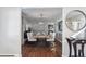 Elegant dining room features wood floors, modern chandelier and neutral decor at 4970 S Chester St, Greenwood Village, CO 80111