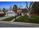 Charming one-story home with manicured lawn and inviting curb appeal, showcasing an appealing exterior at 4970 S Chester St, Greenwood Village, CO 80111
