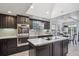 Updated kitchen featuring stainless steel appliances, center island and adjacent dining area at 4970 S Chester St, Greenwood Village, CO 80111