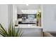 Beautiful kitchen featuring dark cabinetry, quartz countertops, and stainless steel appliances at 4970 S Chester St, Greenwood Village, CO 80111