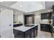 Kitchen featuring center island, stainless steel refrigerator, tile flooring and access to butler's pantry at 4970 S Chester St, Greenwood Village, CO 80111