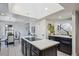 Updated kitchen featuring stainless steel appliances, center island and easy access to dining area at 4970 S Chester St, Greenwood Village, CO 80111