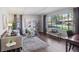 Bright living room with a large window, hardwood floors, stylish furniture, and elegant decor at 4970 S Chester St, Greenwood Village, CO 80111