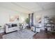 Cozy living room with ample seating, stylish decor, and hardwood floors at 4970 S Chester St, Greenwood Village, CO 80111