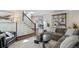 Inviting living room with comfortable seating and an open staircase at 4970 S Chester St, Greenwood Village, CO 80111