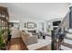 Cozy living room with fireplace, comfortable seating, and open access to the kitchen at 4970 S Chester St, Greenwood Village, CO 80111