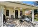 Covered outdoor patio featuring seating, outdoor furniture and access to the backyard at 4970 S Chester St, Greenwood Village, CO 80111