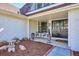 Inviting front porch area, features a bistro set and double door entry at 4970 S Chester St, Greenwood Village, CO 80111