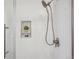 Walk-in shower features subway tile, a glass door, and a built-in shelf at 4970 S Chester St, Greenwood Village, CO 80111